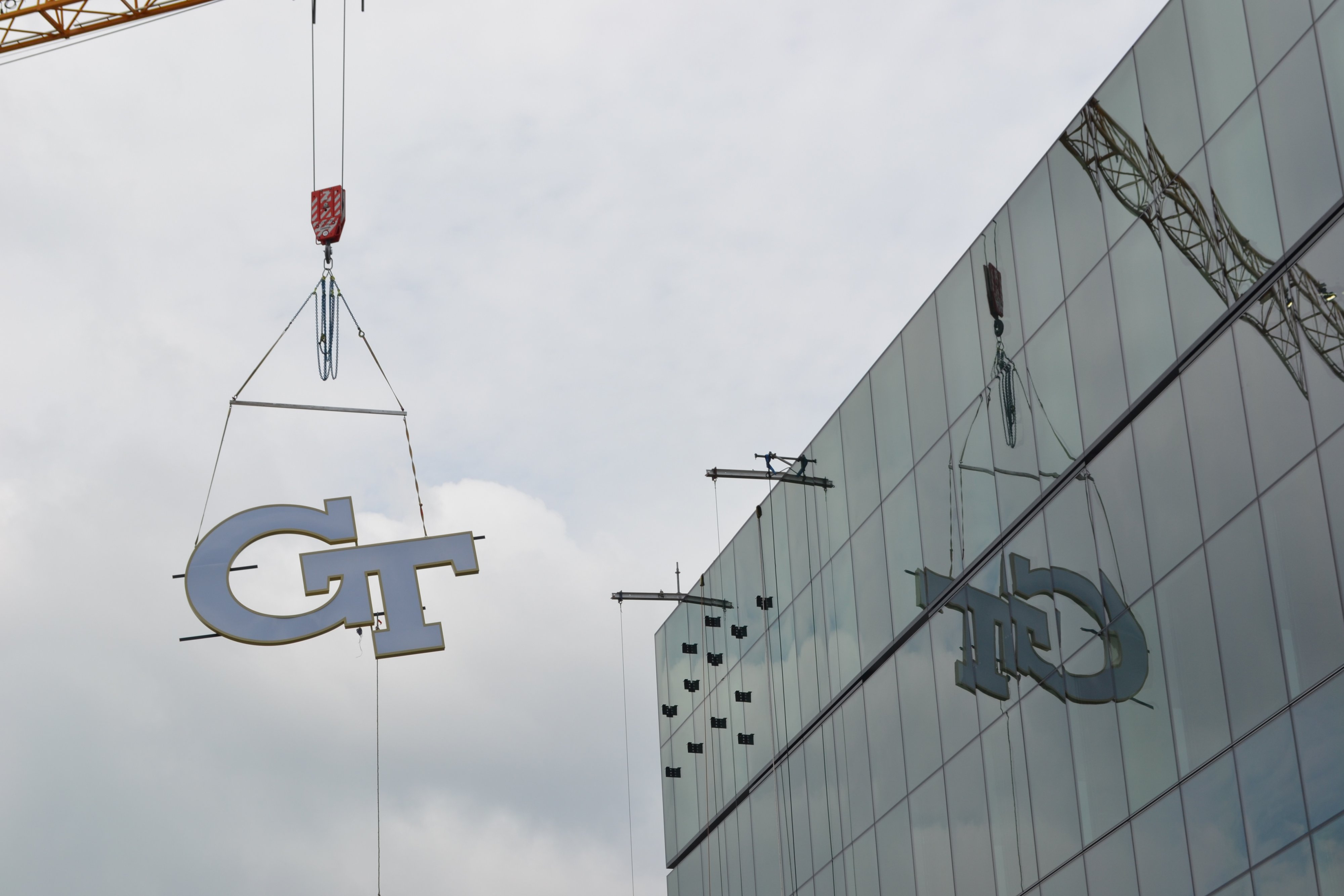 GT logo going up on the north facade of the George Tower