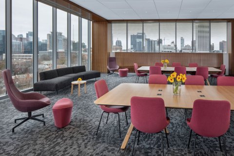 Library interior room with tables and red chairs