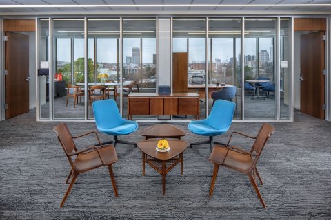 Library interior room with tables and blue chairs